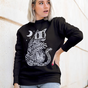 Black sweatshirt and cat silhouette and night scene of blooms, plants, crystals, mushrooms and crescent moon for a witchy vibe