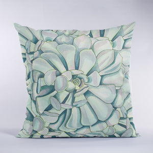 Throw pillow with succulent design in green and soft teal